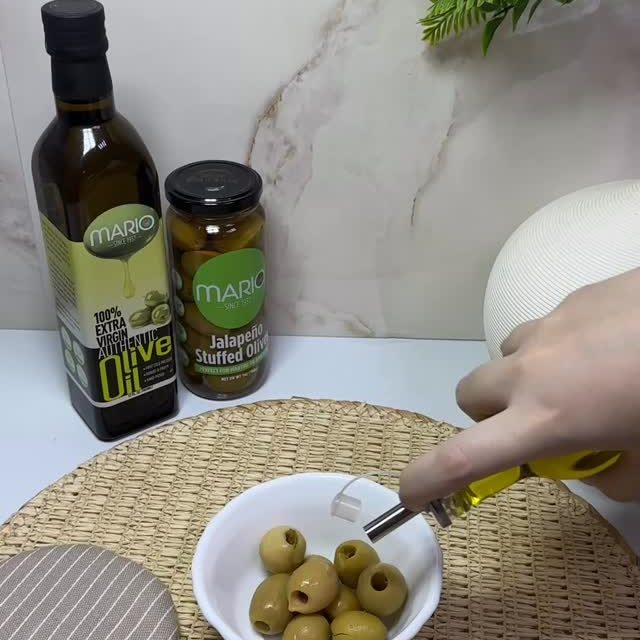 A little drizzle. A little spice. A whole lot of flavor🫒✨
Mario Jalapeño Stuffed Olives finished with olive oil, feta & chili flakes😍Pure obsession!#mariofoods #olives #feta #delicious #trending